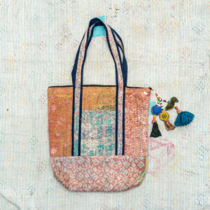 Vintage Kantha tote bag with patchwork stitching and a handmade tassel made from reclaimed materials.