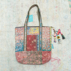 Vintage Kantha tote bag with patchwork stitching and a handmade tassel made from reclaimed materials.