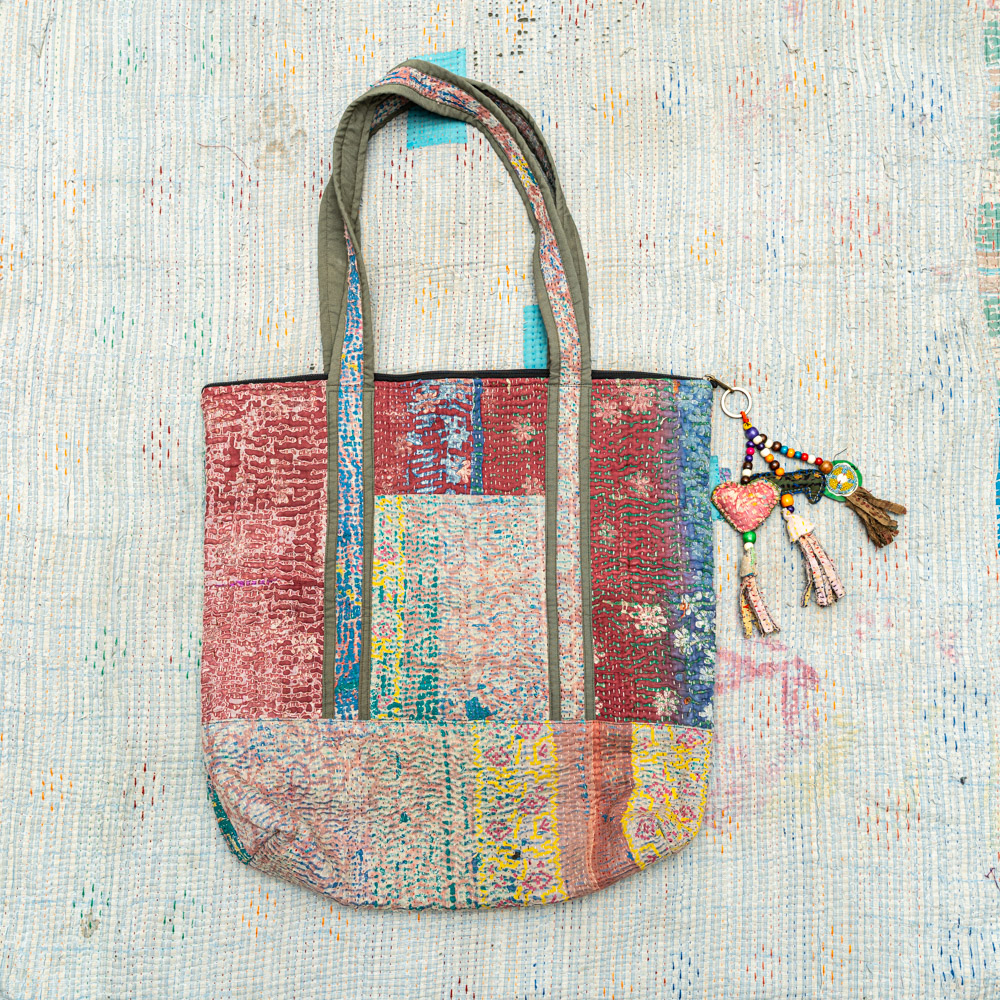 Vintage Kantha tote bag with patchwork stitching and a handmade tassel made from reclaimed materials.