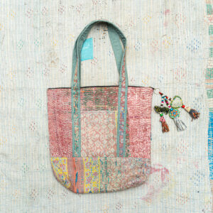 Vintage Kantha tote bag with patchwork stitching and a handmade tassel made from reclaimed materials.