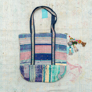 Vintage Kantha tote bag with patchwork stitching and a handmade tassel made from reclaimed materials.