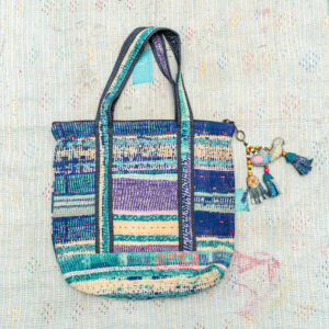 Vintage Kantha tote bag with patchwork stitching and a handmade tassel made from reclaimed materials.