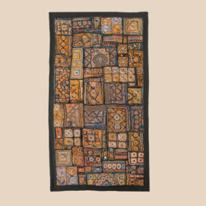 Vintage embroidered textile wall hanging with intricate handwork and visible signs of age.